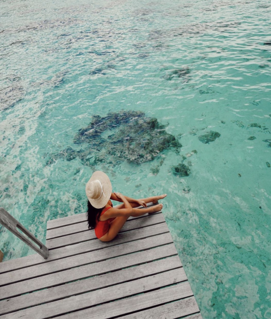 Christina deck by ocean | Four Seasons Bora Bora Review