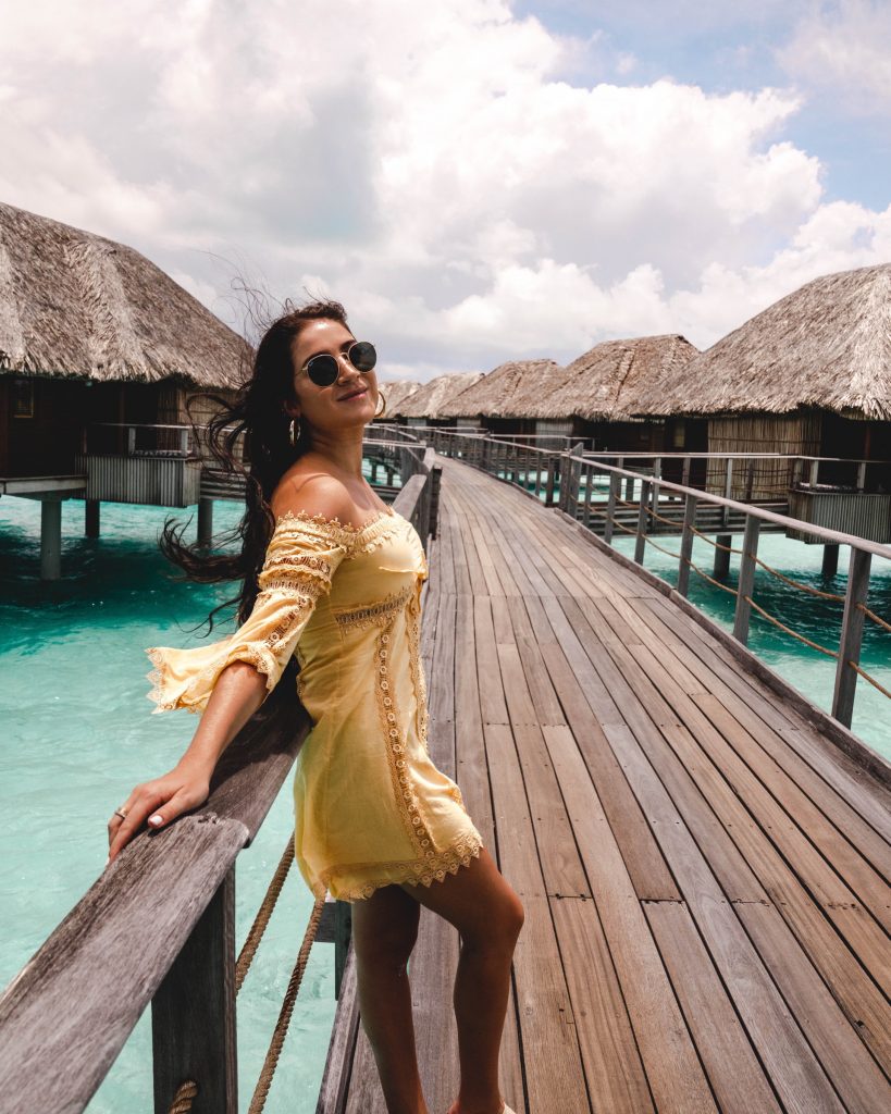 Bora Bora walkway to overwater bungalows Christina at the Four Seasons Bora Bora walkway to overwater bungalows | The Ultimate Bora Bora and Moorea travel guide